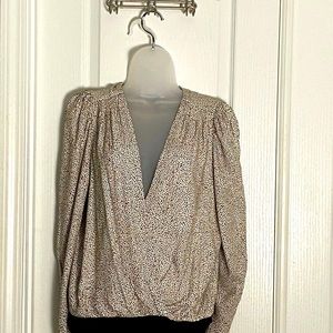 Long sleeve pleated shoulder deep V bodysuit.